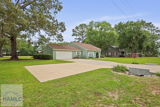 226 Topi Trl, Hinesville, GA 31313 - view of front of home with a garage, a front yard, concrete driveway, and stucco siding