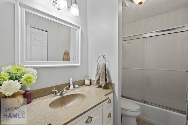 226 Topi Trl, Hinesville, GA 31313 - full bath featuring vanity, toilet, enclosed tub / shower combo, and a textured ceiling