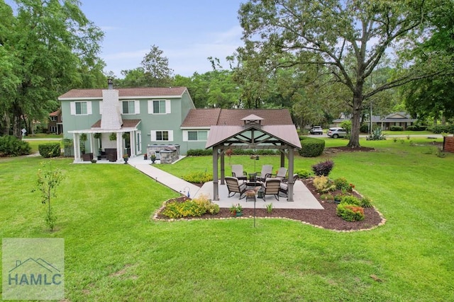 226 Topi Trl, Hinesville, GA 31313 - back of house featuring a gazebo, a patio, a yard, and a chimney