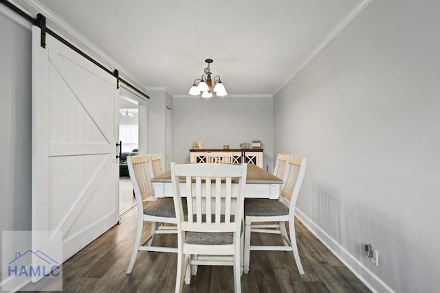 226 Topi Trl, Hinesville, GA 31313 - dining area with a barn door, ornamental molding, wood finished floors, a chandelier, and baseboards