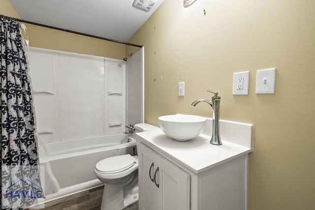 1869 Freedman Grove Rd, Fleming, GA 31309 - bathroom with vanity, shower / bathtub combination with curtain, and wood finished floors