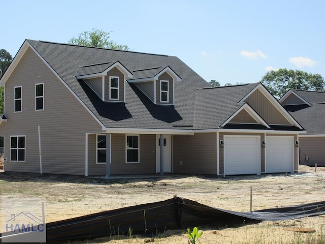 655 Caswell St, Glennville, GA 30427 - view of front of house with a shingled roof and a garage