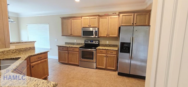 14 Cantebury Rd, Ludowici, GA 31316 - kitchen with stainless steel appliances, light stone countertops, crown molding, and brown cabinets