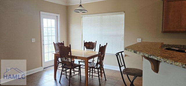 14 Cantebury Rd, Ludowici, GA 31316 - dining room with plenty of natural light, light tile patterned floors, and crown molding