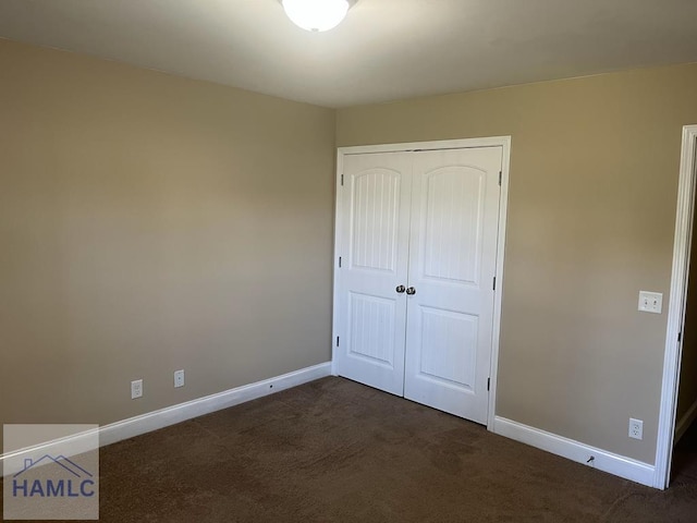 14 Cantebury Rd, Ludowici, GA 31316 - unfurnished bedroom with dark carpet and a closet