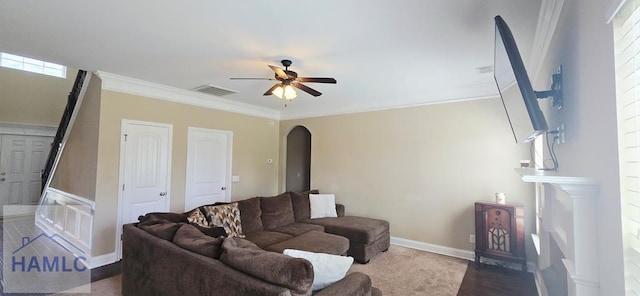 14 Cantebury Rd, Ludowici, GA 31316 - living room featuring ceiling fan, arched walkways, and crown molding