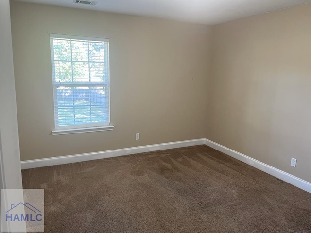 14 Cantebury Rd, Ludowici, GA 31316 - unfurnished room with dark carpet