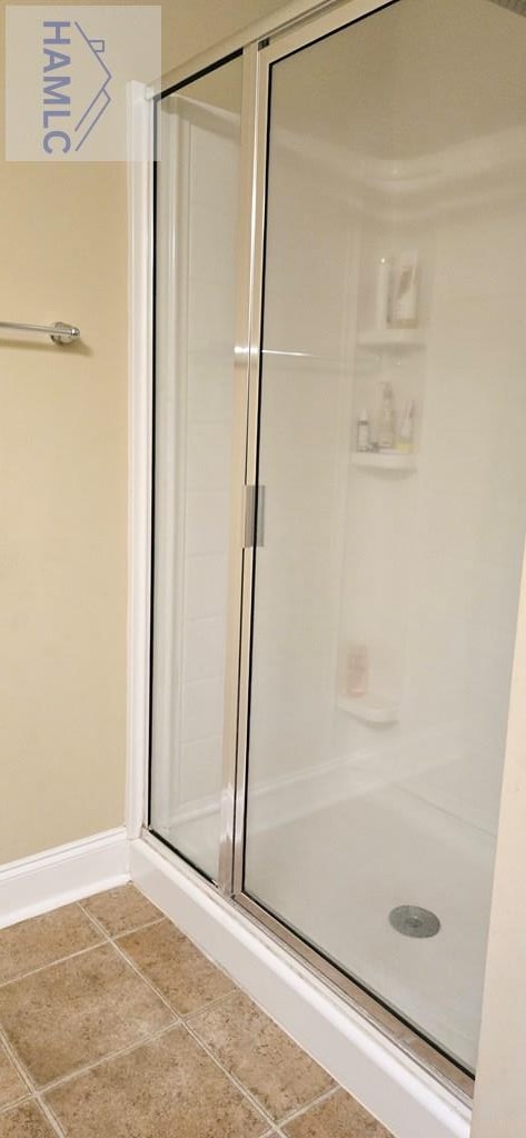 14 Cantebury Rd, Ludowici, GA 31316 - bathroom with a shower stall and tile patterned flooring