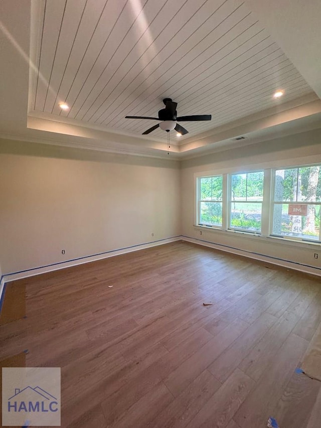43 Belle Island Way, Richmond Hill, GA 31324 - spare room with a tray ceiling, wooden ceiling, hardwood / wood-style flooring, ceiling fan, and ornamental molding