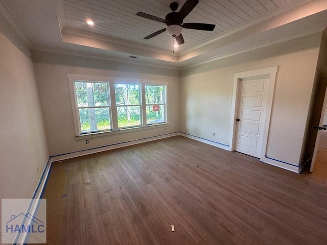 43 Belle Island Way, Richmond Hill, GA 31324 - unfurnished room featuring a raised ceiling, wood finished floors, a ceiling fan, and ornamental molding