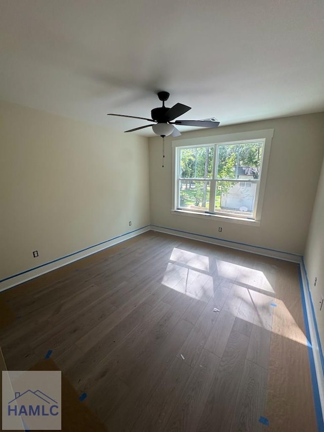 43 Belle Island Way, Richmond Hill, GA 31324 - unfurnished room with wood finished floors and ceiling fan