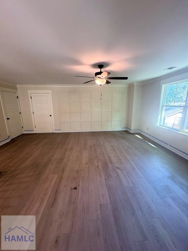 43 Belle Island Way, Richmond Hill, GA 31324 - unfurnished living room with a ceiling fan, wood finished floors, and ornamental molding