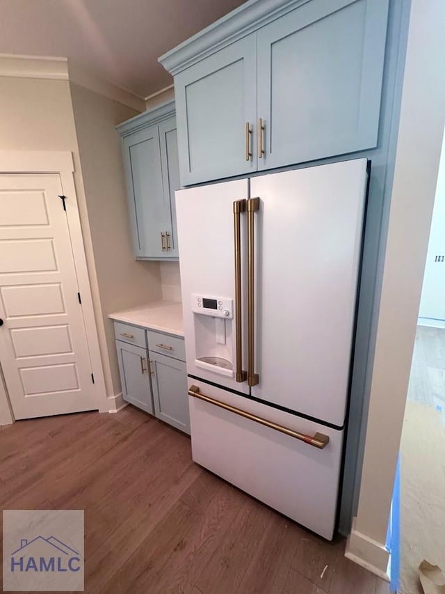 43 Belle Island Way, Richmond Hill, GA 31324 - kitchen with high end white fridge, gray cabinetry, ornamental molding, and dark wood-style flooring