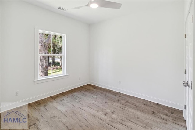 empty room featuring light wood-type flooring and ceiling fan