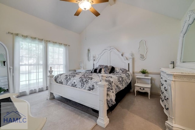 carpeted bedroom with beamed ceiling, ceiling fan, and high vaulted ceiling