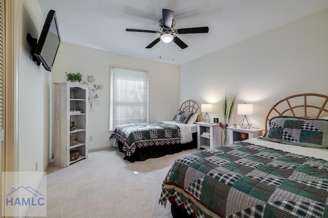 bedroom with ceiling fan and carpet