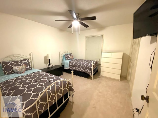 bedroom with ceiling fan and light colored carpet