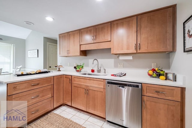 kitchen with dishwasher, light tile patterned floors, sink, and kitchen peninsula