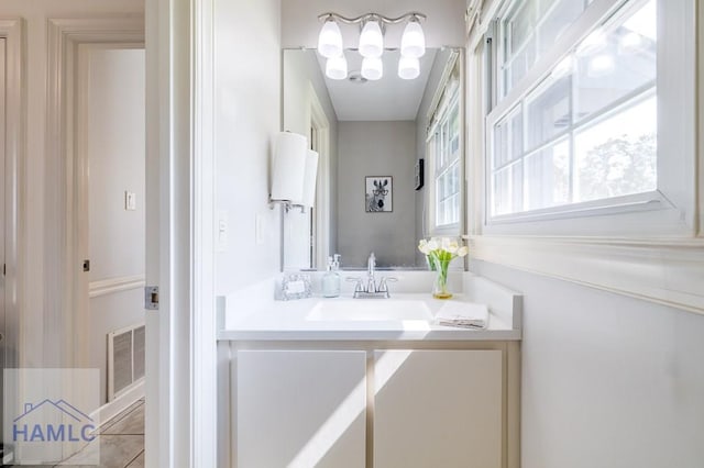 bathroom featuring vanity and an inviting chandelier