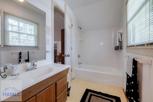 bathroom featuring vanity and tiled shower / bath combo