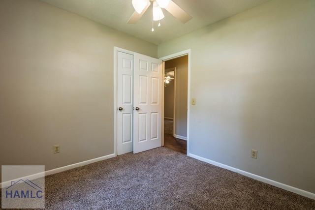 unfurnished bedroom featuring ceiling fan and carpet