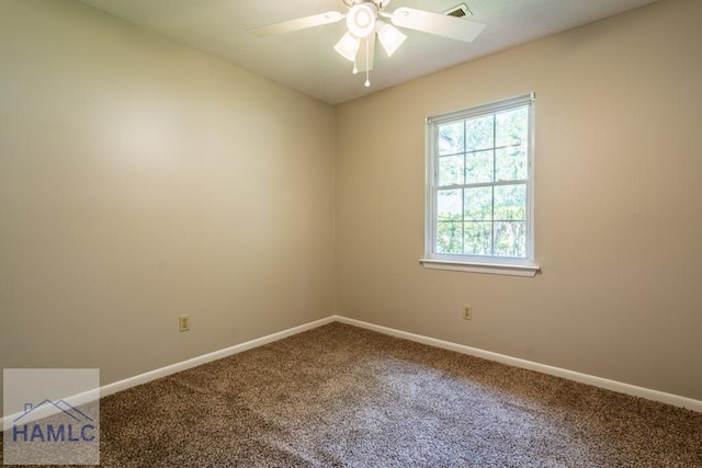 carpeted spare room with ceiling fan