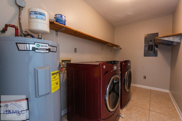 laundry room with washing machine and dryer, electric water heater, electric panel, a textured ceiling, and light tile patterned floors