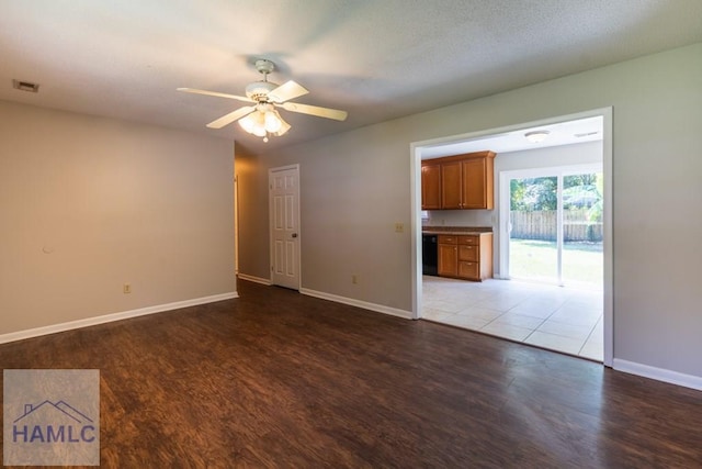 spare room featuring ceiling fan and hardwood / wood-style floors