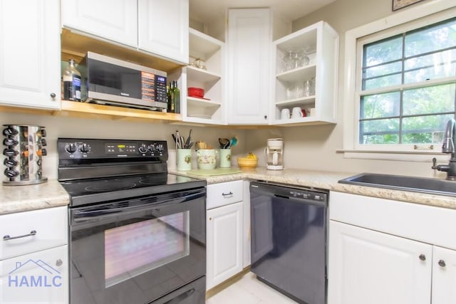 375 Eastridge Rd, Savannah, GA 31406 - kitchen with black appliances, white cabinetry, and sink