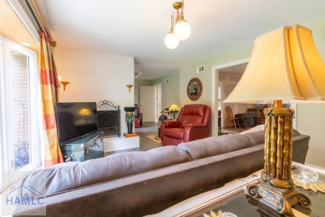 375 Eastridge Rd, Savannah, GA 31406 - living room with a fireplace and wood-type flooring