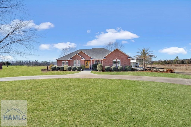 ranch-style house with a front lawn