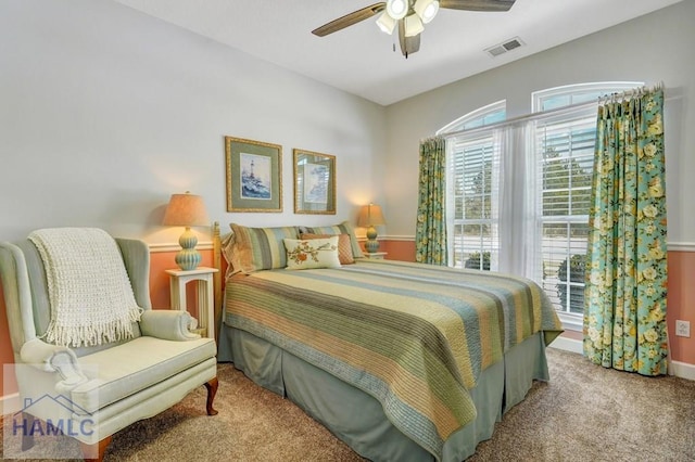 bedroom featuring light colored carpet and ceiling fan