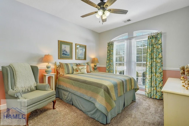 bedroom featuring light colored carpet and ceiling fan