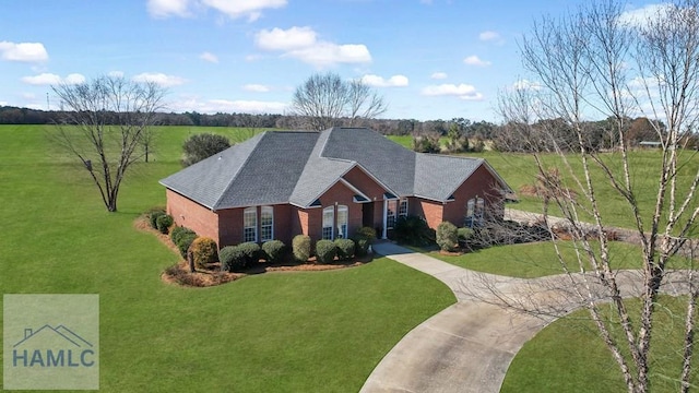 single story home with a front lawn