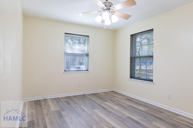 unfurnished room featuring light hardwood / wood-style flooring and ceiling fan