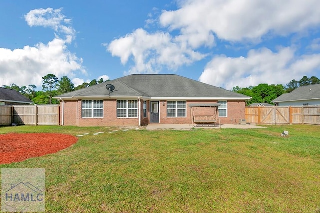 365 Carson St NE, Ludowici, GA 31316 - rear view of property featuring a patio area, brick siding, and a gate