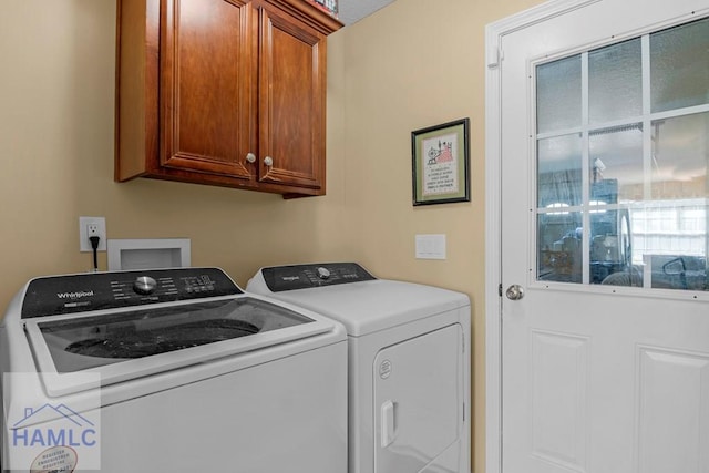 365 Carson St NE, Ludowici, GA 31316 - laundry area featuring washing machine and clothes dryer and cabinet space