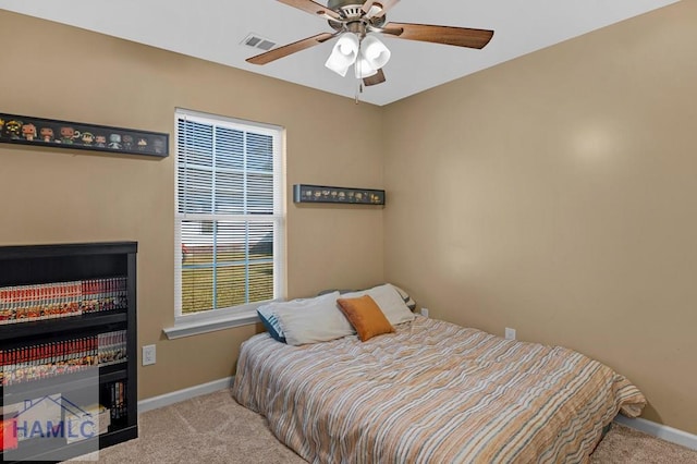 365 Carson St NE, Ludowici, GA 31316 - carpeted bedroom featuring baseboards and ceiling fan