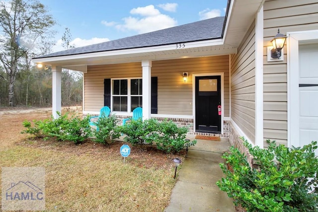 doorway to property with a porch