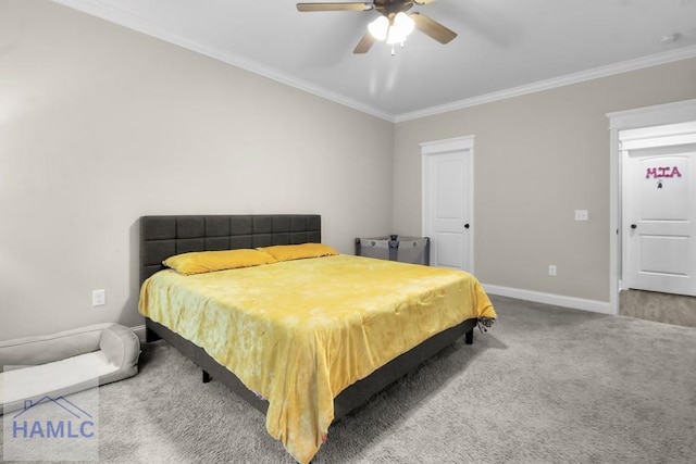 carpeted bedroom featuring ornamental molding and ceiling fan