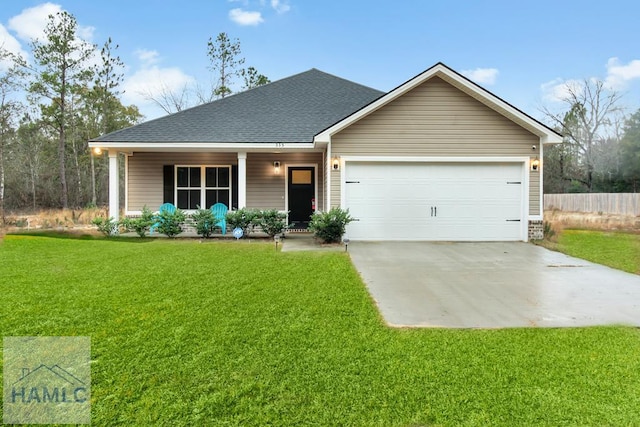 ranch-style home with a garage and a front lawn