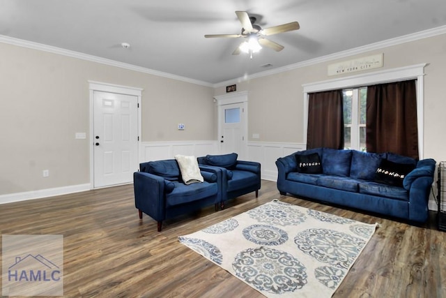 living room with crown molding, ceiling fan, and dark hardwood / wood-style flooring