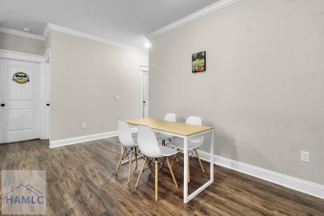 dining area featuring crown molding and dark hardwood / wood-style floors