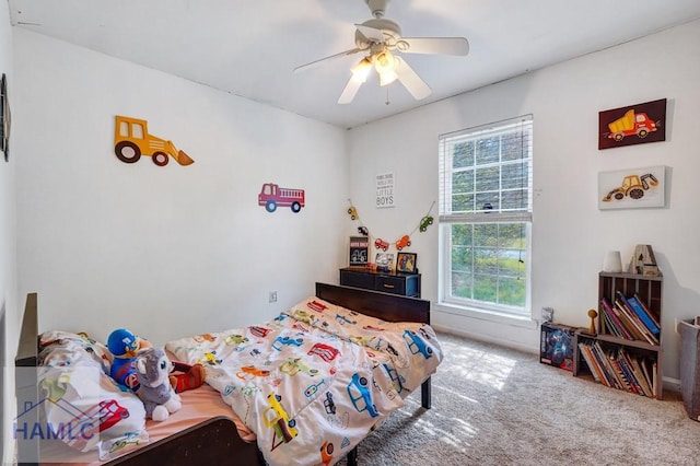 bedroom with ceiling fan and carpet flooring