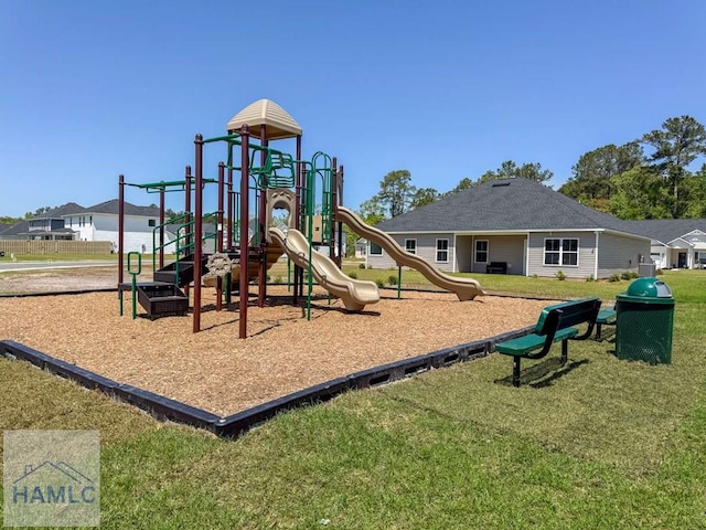 community playground featuring a lawn