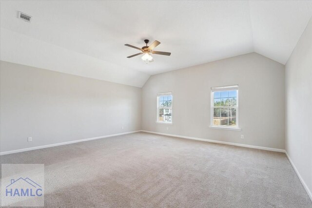 7 Summerhill Dr, Ludowici, GA 31316 - spare room with visible vents, baseboards, ceiling fan, carpet, and vaulted ceiling