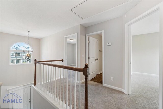 7 Summerhill Dr, Ludowici, GA 31316 - corridor with carpet floors, baseboards, attic access, and an upstairs landing