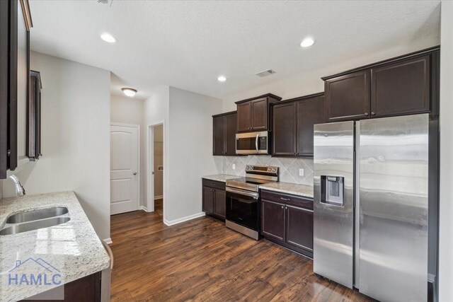 7 Summerhill Dr, Ludowici, GA 31316 - kitchen with a sink, appliances with stainless steel finishes, dark wood-style floors, and dark brown cabinets