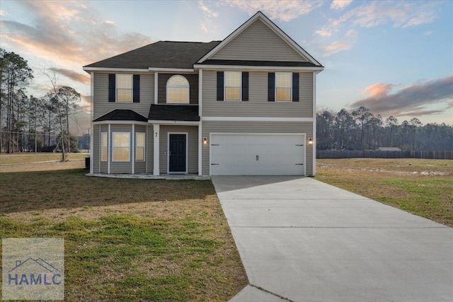 7 Summerhill Dr, Ludowici, GA 31316 - traditional home featuring concrete driveway, an attached garage, and a yard