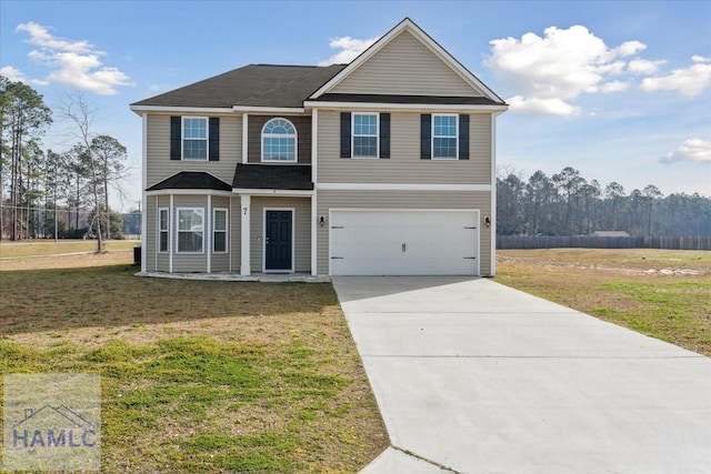 7 Summerhill Dr, Ludowici, GA 31316 - view of front of house featuring an attached garage, concrete driveway, and a front lawn